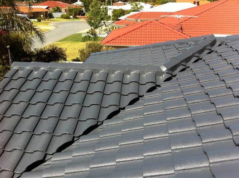 Charcoal cement tile roof after a full Roof Plus restoration