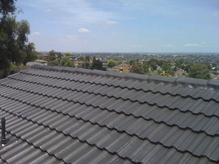 Restored grey tile roof overlooking Melbourne's south-eastern suburbs